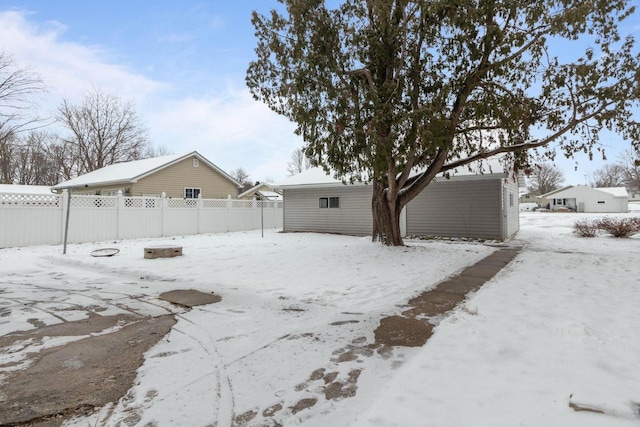 view of yard layered in snow