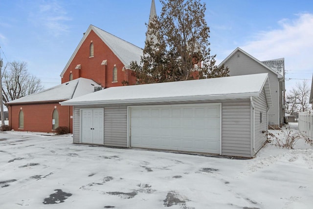 view of snow covered garage