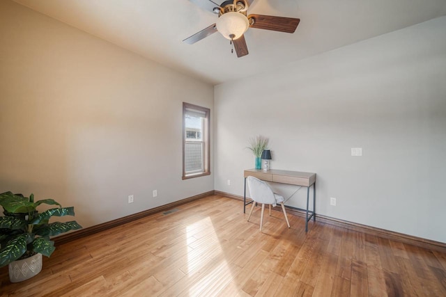 office with ceiling fan and light hardwood / wood-style flooring