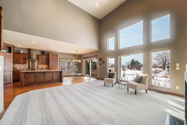 interior space featuring a chandelier, sink, and light hardwood / wood-style flooring