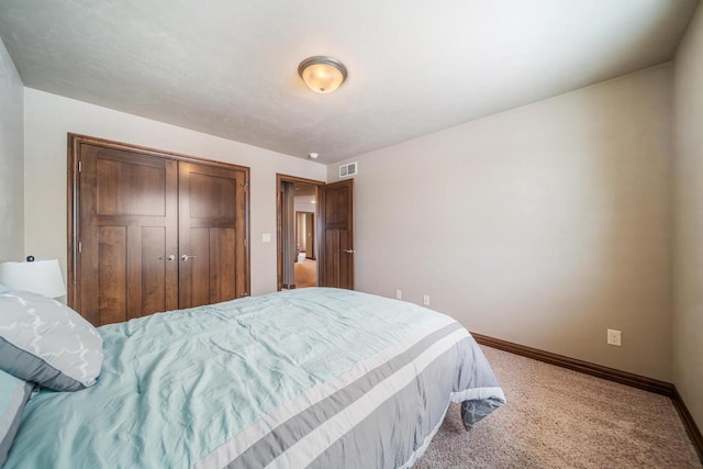 carpeted bedroom featuring a closet