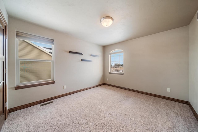 spare room with carpet flooring