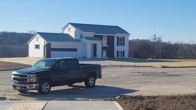 view of front of property with a garage