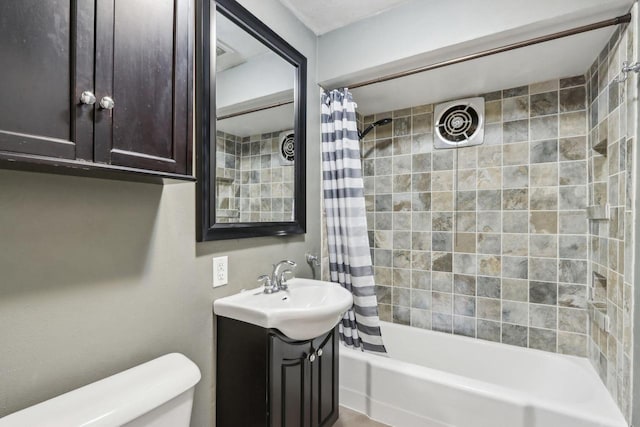 full bathroom with vanity, toilet, and shower / bath combo