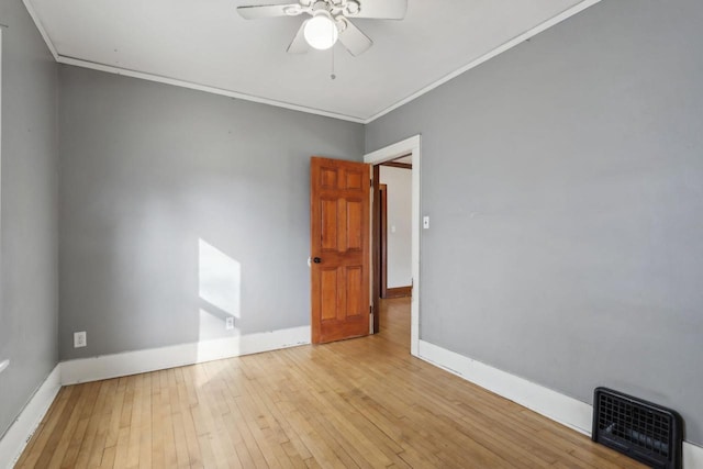 unfurnished room featuring crown molding, ceiling fan, and light hardwood / wood-style floors