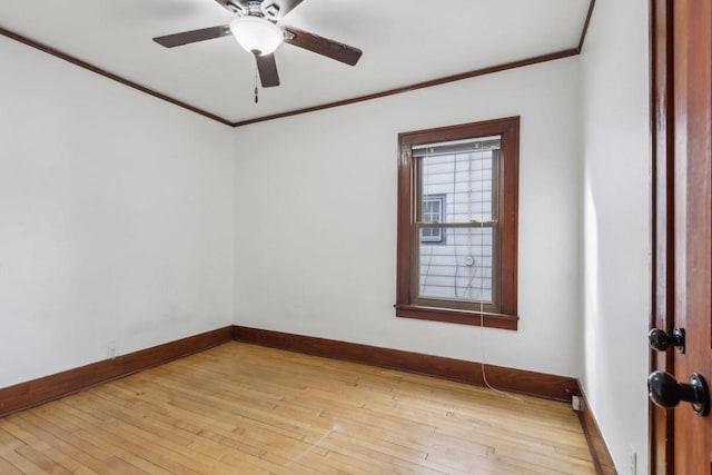 spare room featuring ornamental molding, ceiling fan, and light hardwood / wood-style flooring