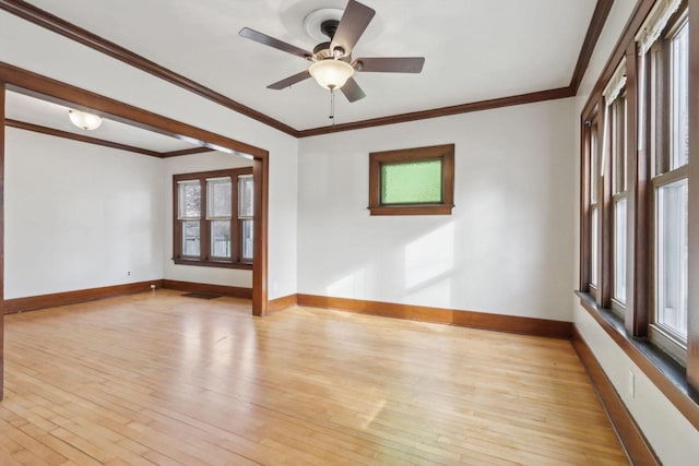 unfurnished room featuring ornamental molding, light hardwood / wood-style floors, and ceiling fan