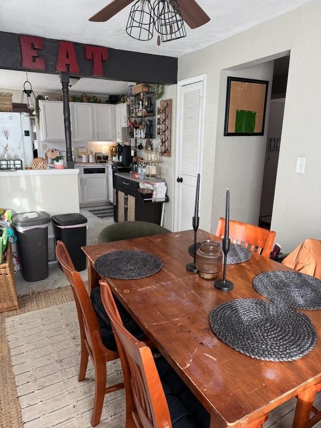 dining space featuring ceiling fan