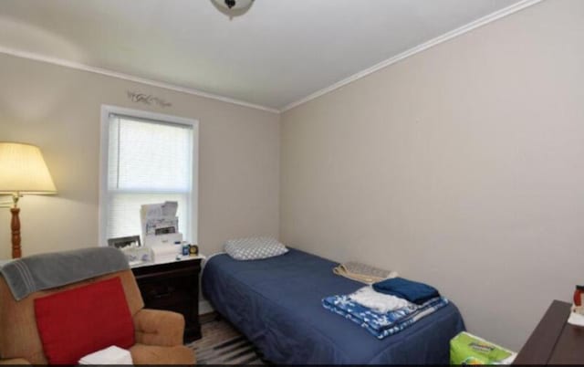 bedroom featuring crown molding