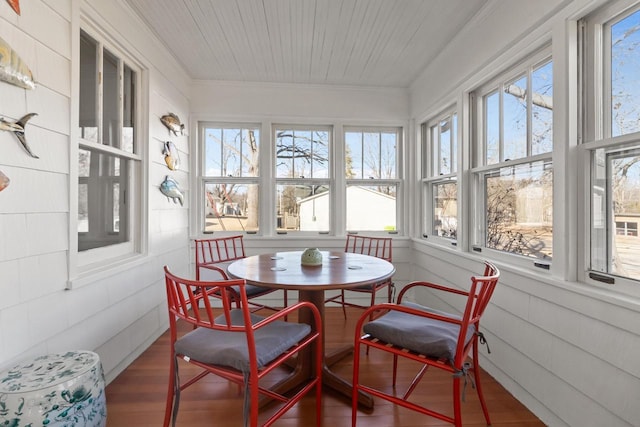 sunroom featuring wood ceiling and a wealth of natural light