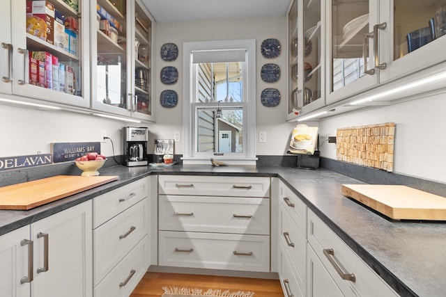 kitchen featuring white cabinetry and light wood-type flooring