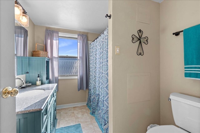 bathroom featuring vanity, tile patterned floors, and toilet