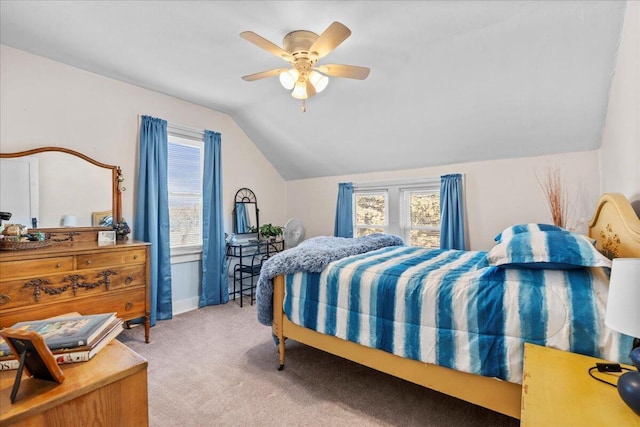 carpeted bedroom with ceiling fan and lofted ceiling