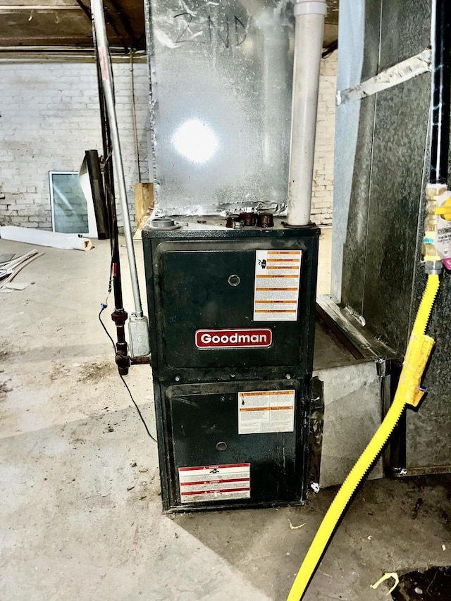 utility room featuring heating unit