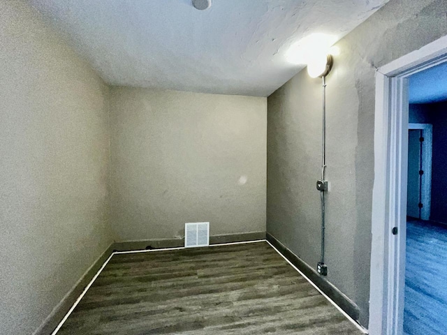 laundry area featuring dark hardwood / wood-style floors