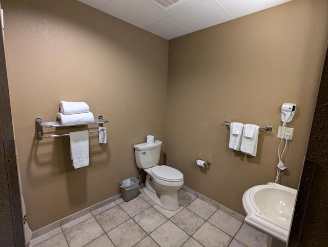 bathroom featuring tile patterned flooring, sink, and toilet