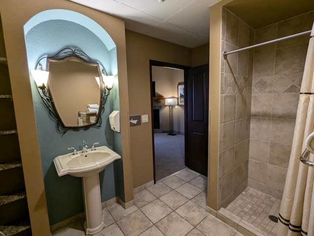 bathroom featuring a shower with curtain and tile patterned flooring