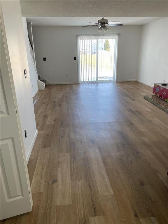 interior space with hardwood / wood-style flooring and ceiling fan