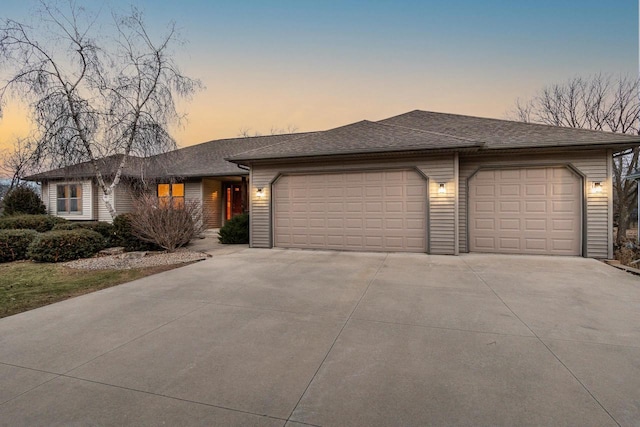 single story home with a garage