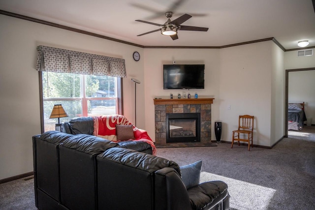 carpeted living room with ceiling fan and ornamental molding