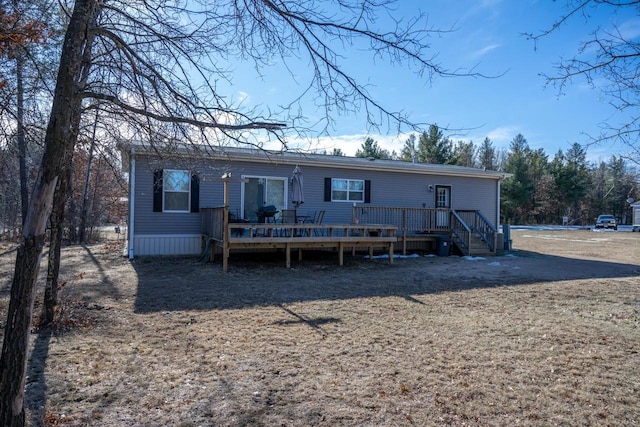 back of property featuring a deck