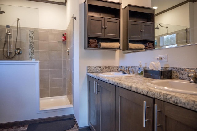 bathroom featuring vanity and a tile shower