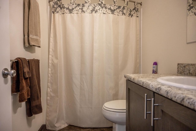 bathroom with vanity and toilet