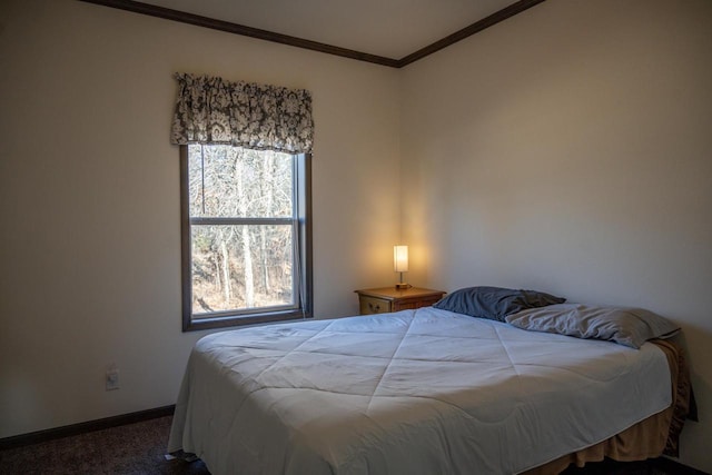 carpeted bedroom with ornamental molding