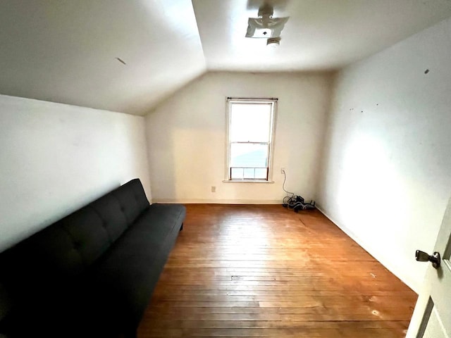 bonus room with vaulted ceiling and hardwood / wood-style floors