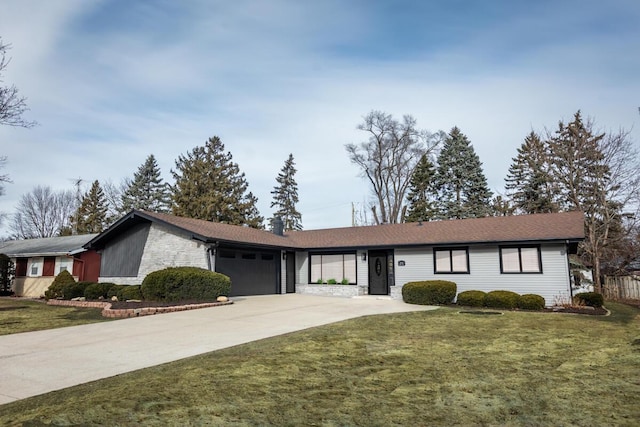 ranch-style home featuring a garage and a front yard