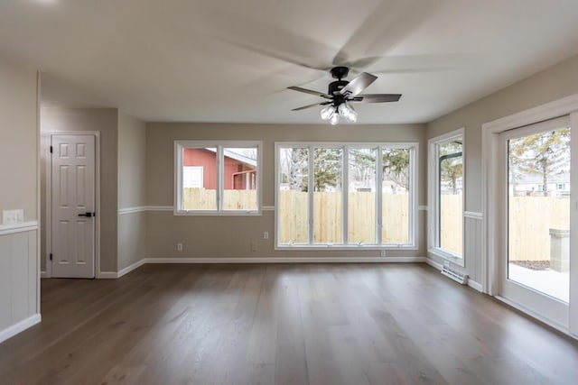 interior space with a healthy amount of sunlight and ceiling fan