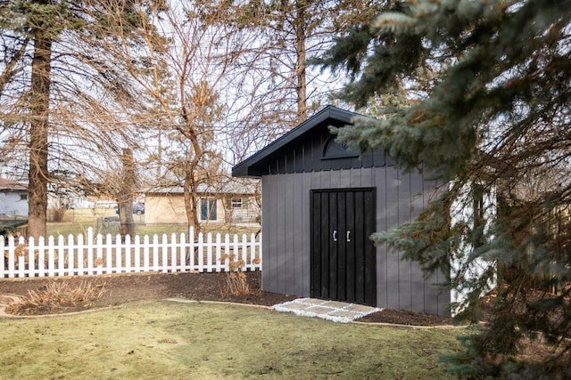 view of outbuilding with a yard