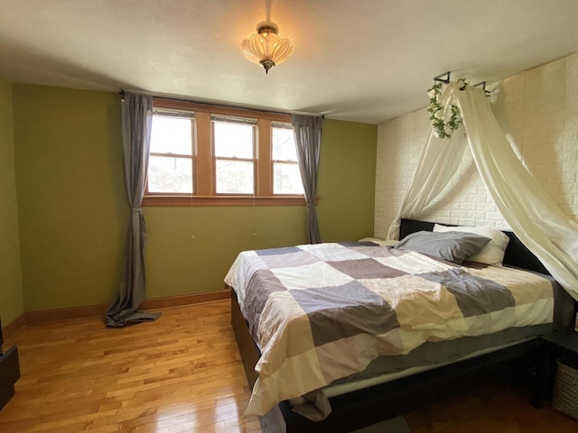 bedroom with light hardwood / wood-style flooring