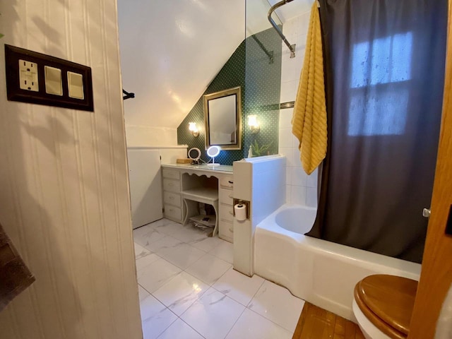 bathroom with vaulted ceiling, shower / bathtub combination with curtain, and toilet