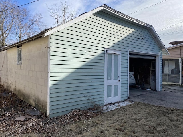 view of side of home with a garage