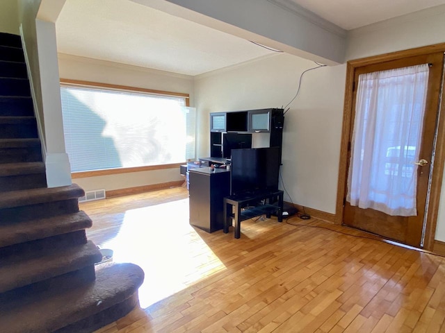 office featuring crown molding and light hardwood / wood-style floors