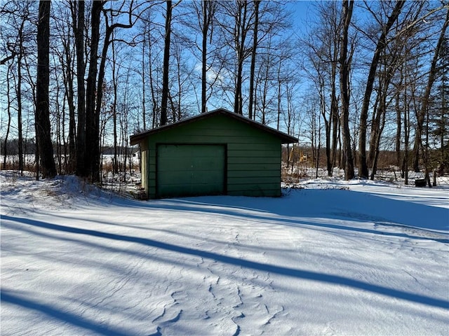 view of snow covered garage