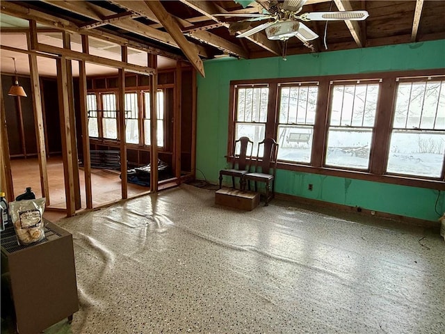 misc room with ceiling fan and a wealth of natural light