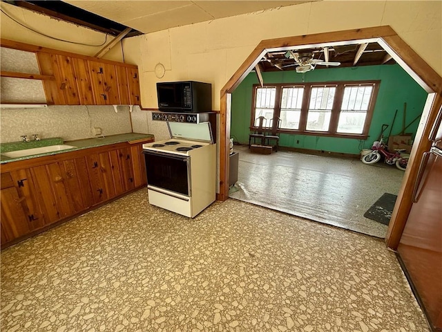 kitchen with sink and white electric range