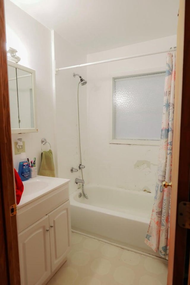 bathroom featuring vanity and shower / tub combo