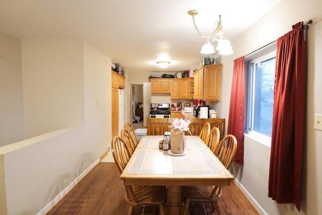 dining space featuring wood-type flooring