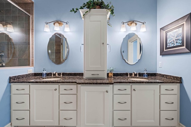 bathroom with vanity and an enclosed shower