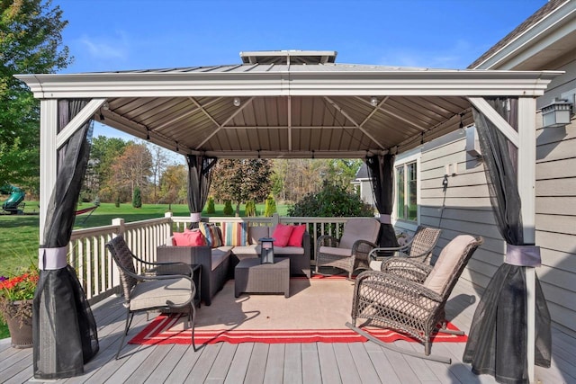 wooden terrace with a gazebo and an outdoor hangout area