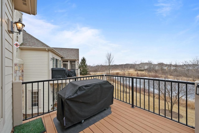 wooden terrace featuring grilling area