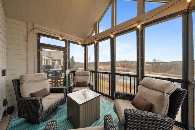 sunroom / solarium with vaulted ceiling and a wealth of natural light