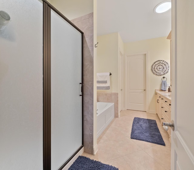 bathroom featuring vanity, tile patterned floors, and independent shower and bath