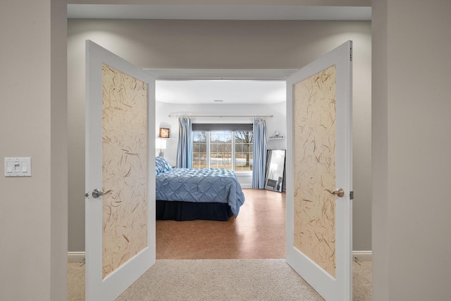 hallway featuring carpet flooring