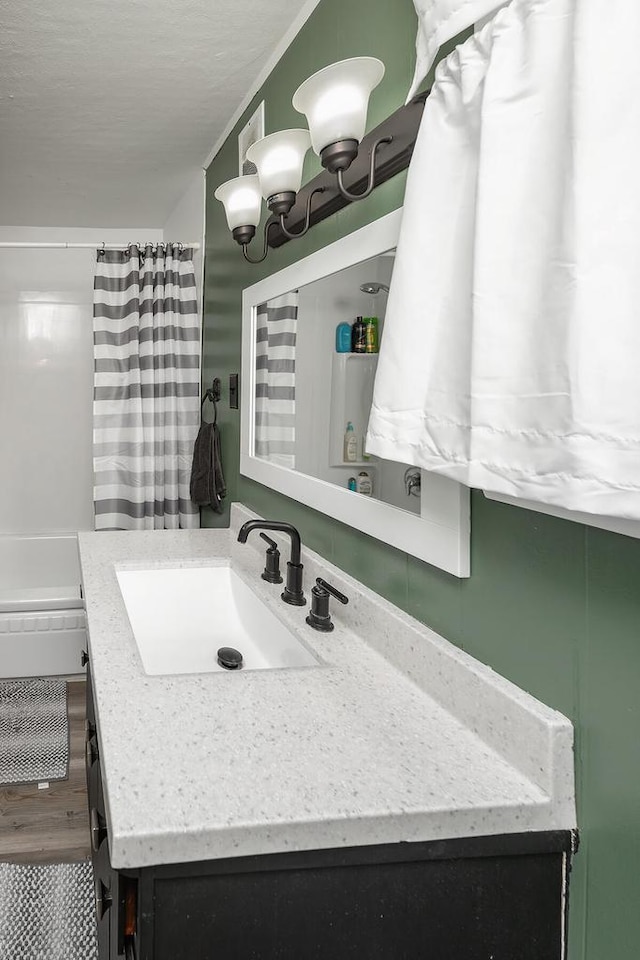 bathroom with vanity, a notable chandelier, a textured ceiling, and a shower with shower curtain