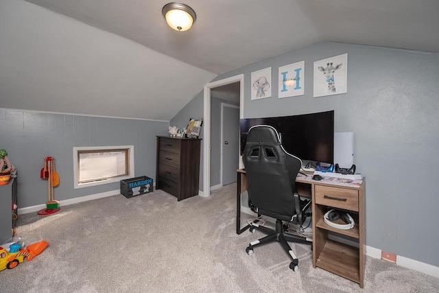 carpeted office with vaulted ceiling