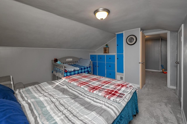 carpeted bedroom featuring lofted ceiling